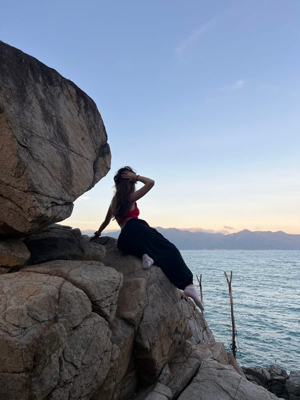 Visitors explore rocky coastline formations in Vĩnh Lương, Vietnam