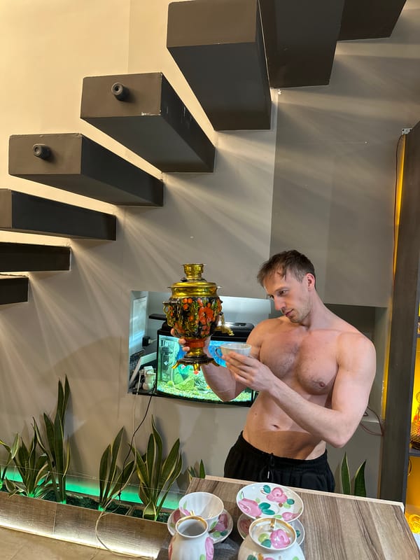 Man uses traditional samovar in Kursk home interior