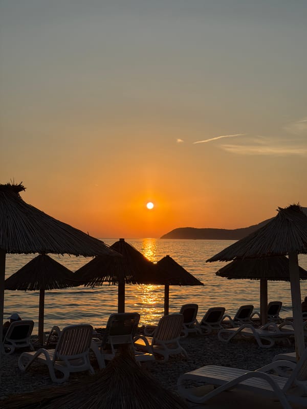 Empty beach chairs at sunset on Montenegro's Adriatic coast