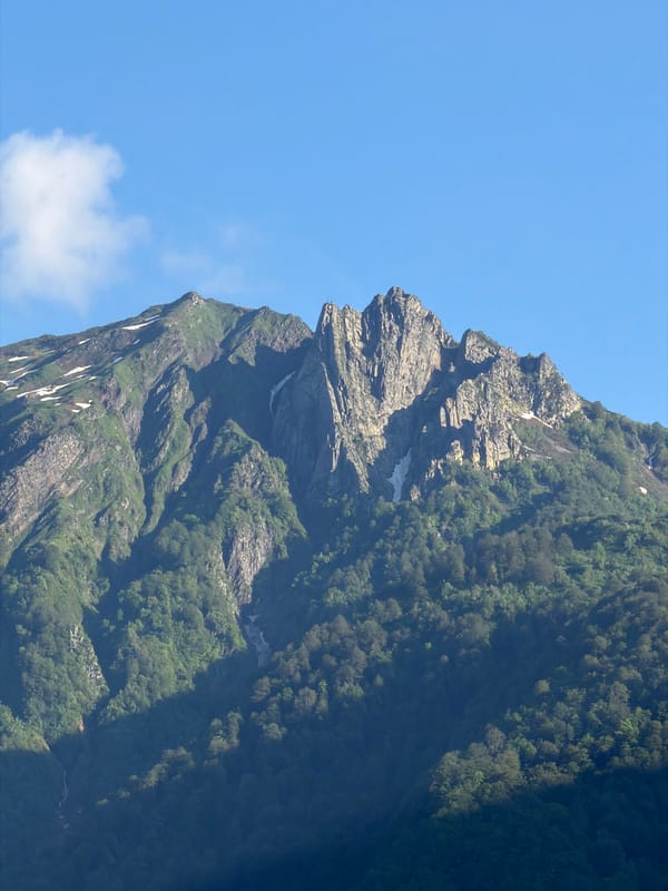Mountain peaks and forested hillsides in Krasnaya Polyana