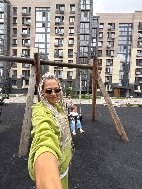 Playground morning in Rusanovo with swings and a toddler