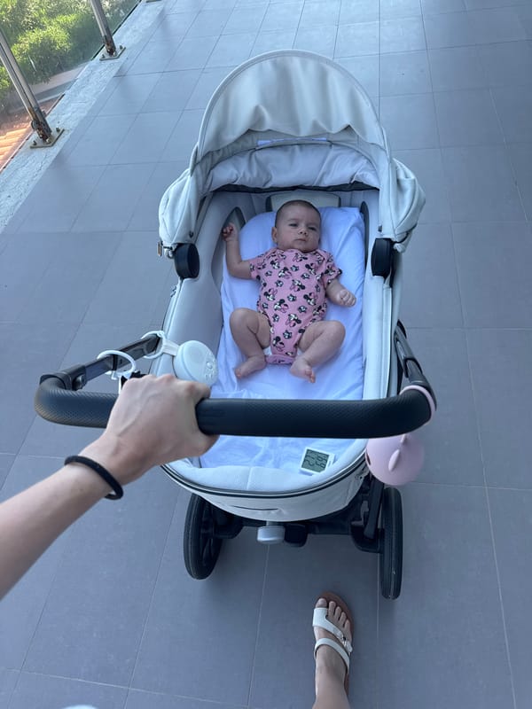 Morning by the sea in Capaci with coastal views and a stroller.