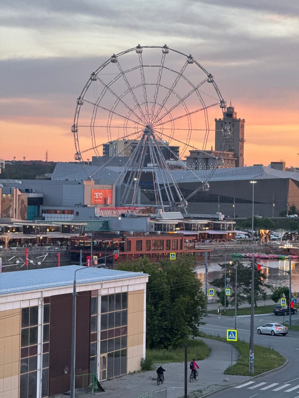 Sunset captured over Chelyabinsk cityscape along Miass River