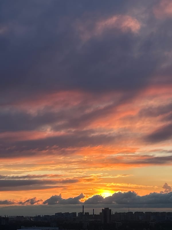 City skyline sunset with vivid cloud layers