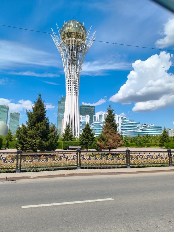 Astana landmarks: Bayterek Tower and glass telecom building