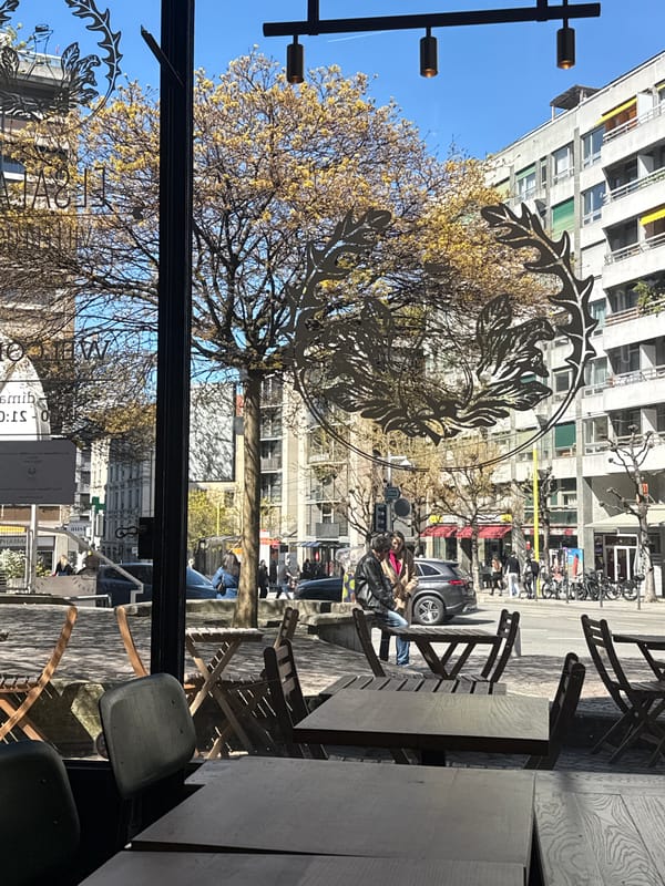 Woman enjoys orange juice at Geneva café