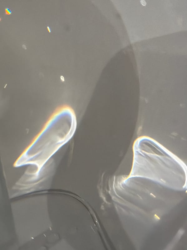 Berlin resident captures wine glass light refractions on surface