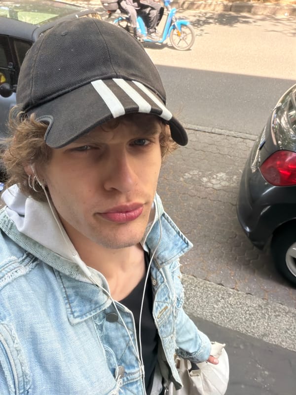 Young man in denim jacket observed in Milan