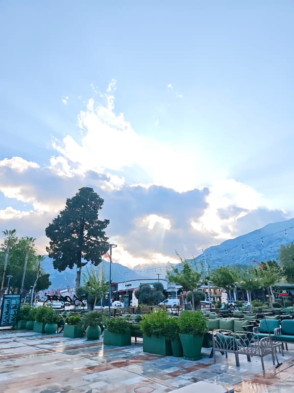 Spring visitors explore Kemer park amid blooming wisteria, camel statues