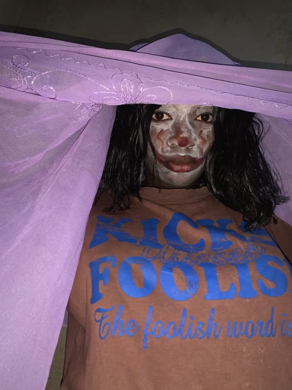 Person with face paint observed on ground in Agban