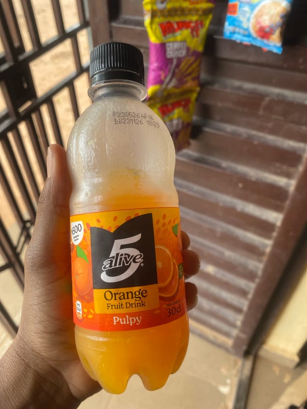 A drink in hand and a cloudy sky in Lafia, Nigeria