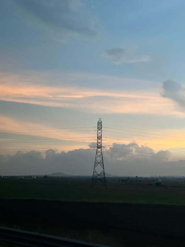 Transmission tower observed in agricultural field near Calpulalpan, Mexico