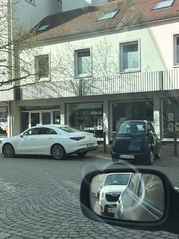 White Mercedes CLA spotted parked on Ulm cobblestone street