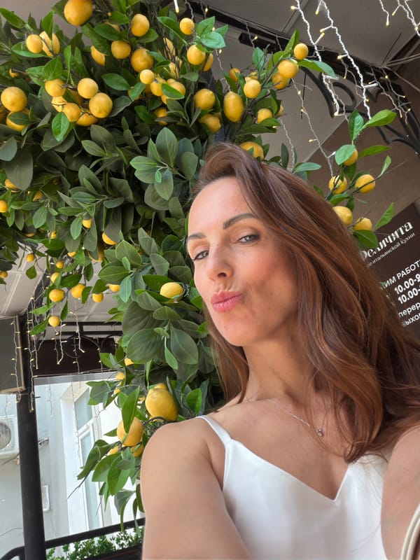 Sunny afternoon at a Birobidzhan outdoor café with lemon tree decor.