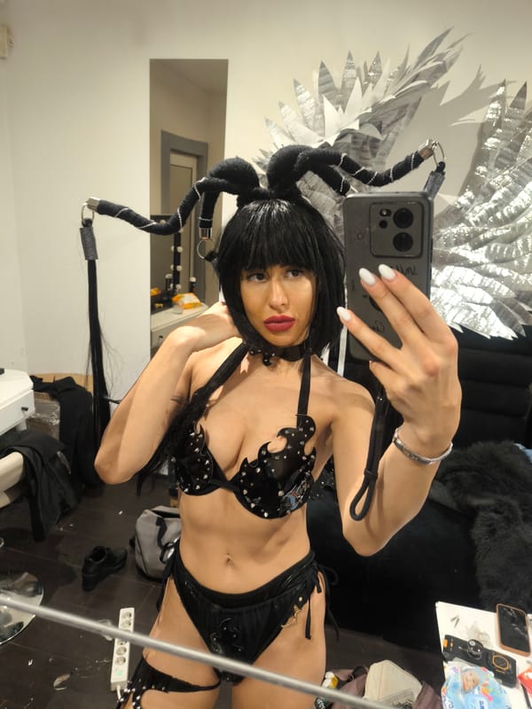 Woman takes mirror selfie in costume wig in Sofia