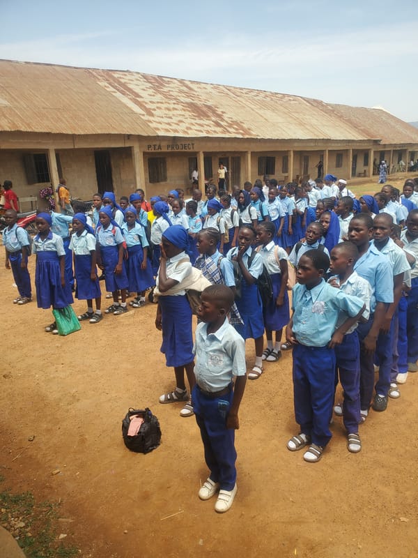 School children assemble in uniforms at Akwanga Nigeria schoolyard