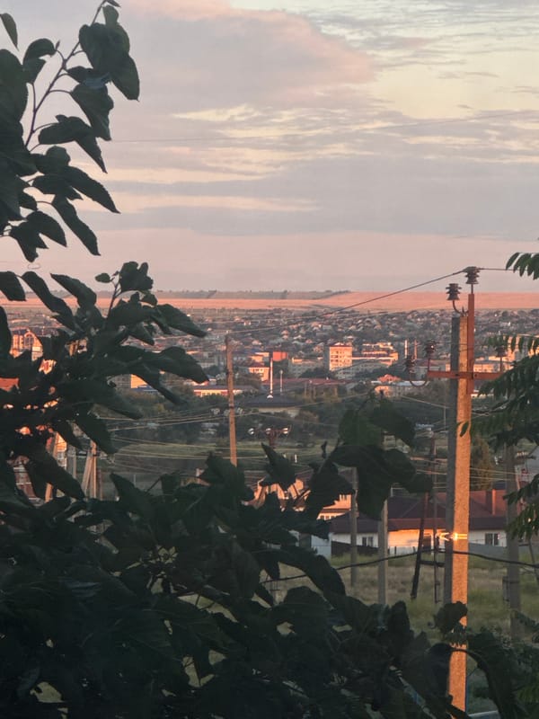 Dusk settles over a city in warm golden light