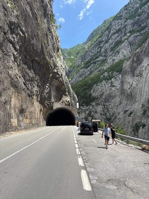 Woman takes selfie on mountain road near Vlahovići, Montenegro