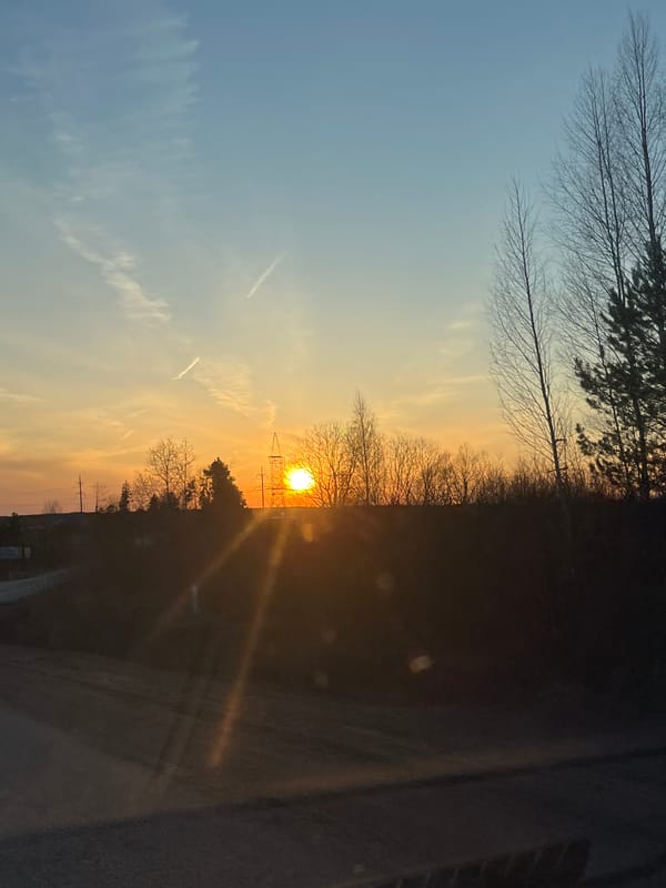 Sunset photographed between utility poles in Foki, Russia