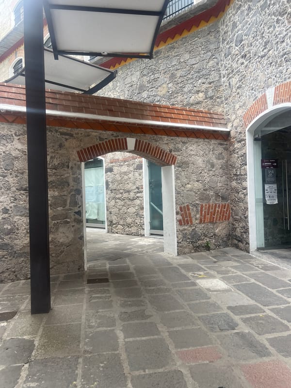 Stone passageway with brick arches documented in Puebla