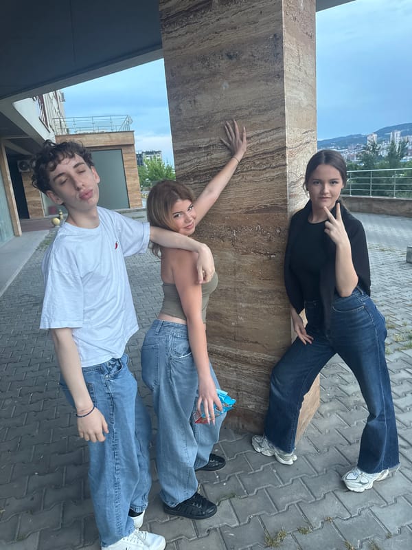 Young friends gather for sunset photos at urban plaza