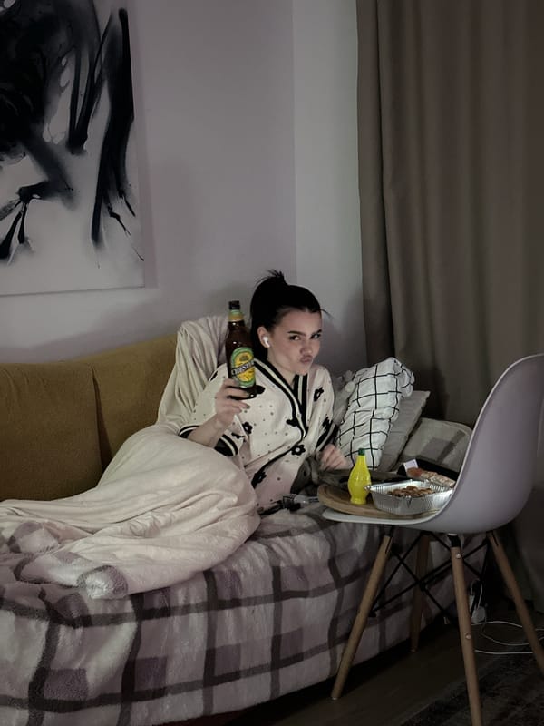 Woman relaxes on couch with bottle in Lyubertsy home