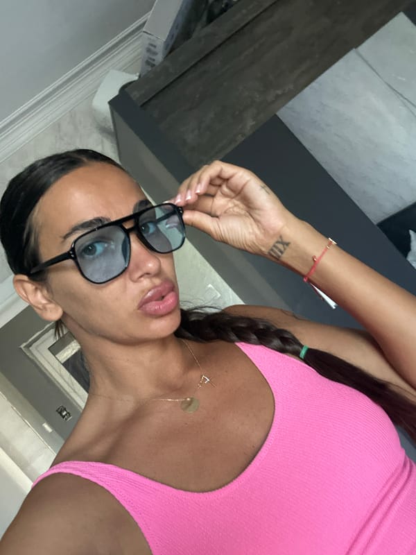 Selfie moment in Pernik, bold glasses and pink tank top