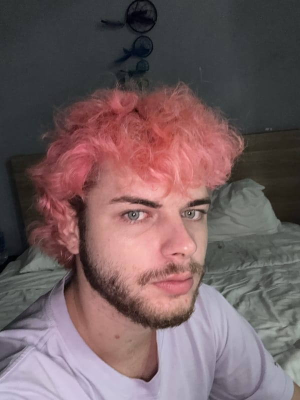 Pink-haired man photographed in bedroom, Đà Nẵng Vietnam