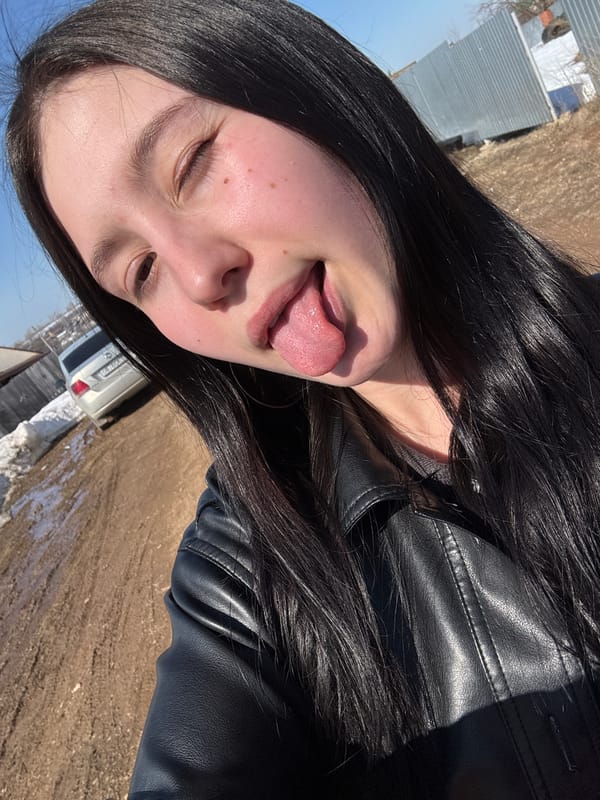 Woman poses playfully for photo in Foki, Russia