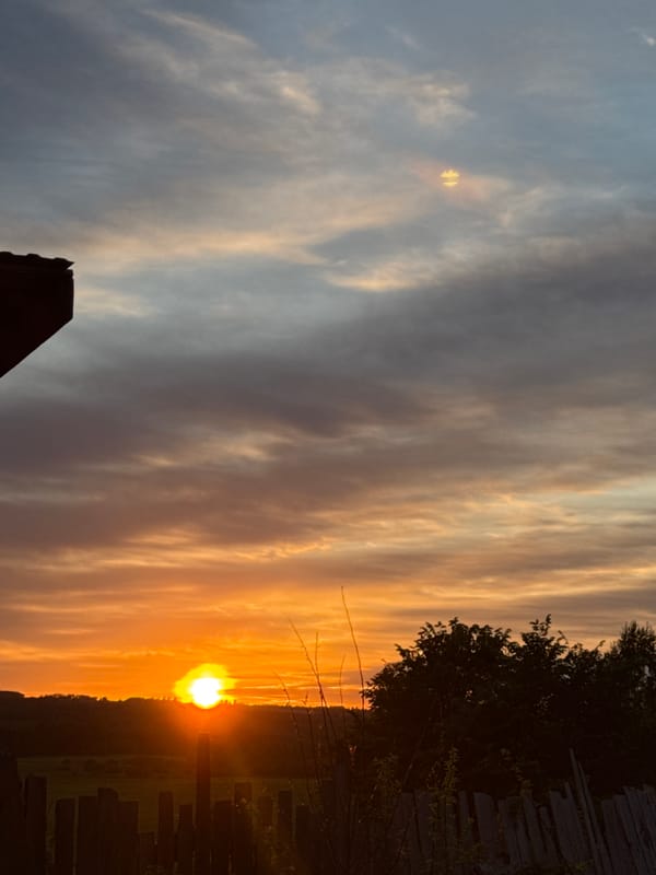 Woman documents sunset moment in rural Russian village