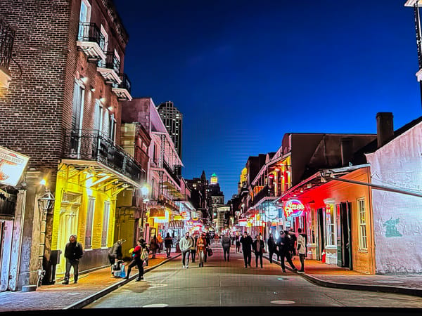 Miami Beach street at night, neon lights and historic architecture