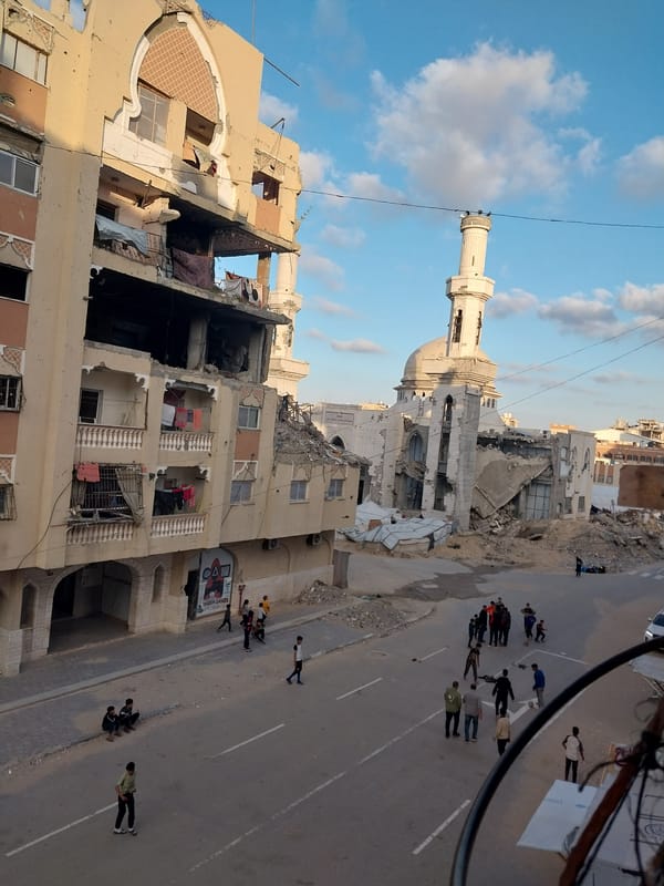Street scene shows damaged buildings, mosque in Khan Yunis