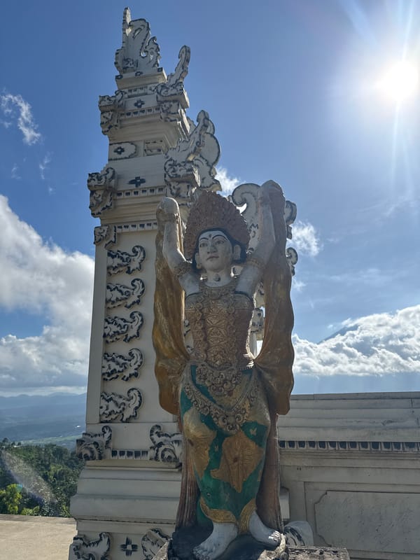Stone statue observed in Abang, Indonesia under sunny skies