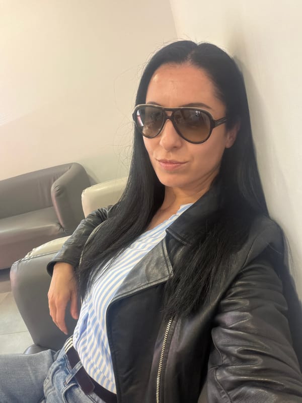 Woman in leather jacket and striped shirt spotted