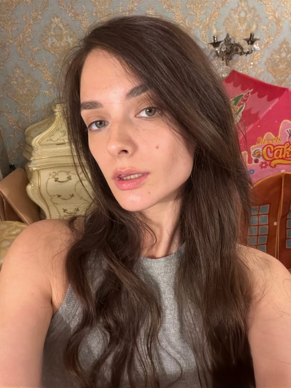 Back-to-back selfies in a Ufa bedroom, same spot.