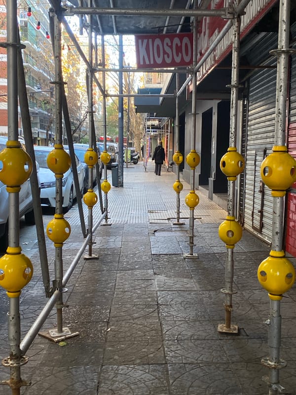 Street scene near scaffolding and apartments in Buenos Aires