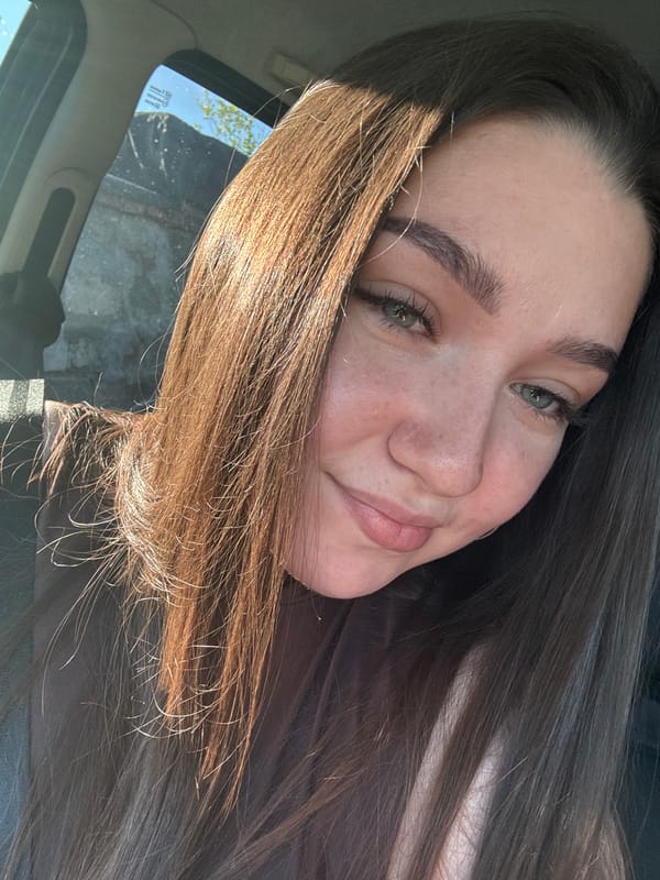 Woman takes car selfies in Russian village