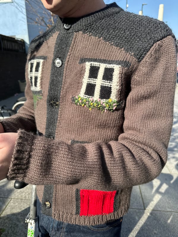 Person in distinctive knitted cardigan photographed in sunny London