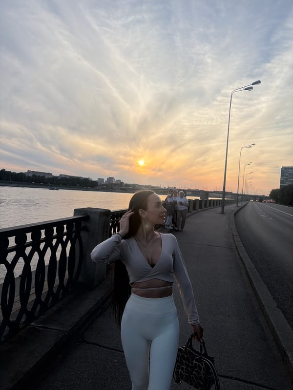 Evening scenes documented along Russian city riverside during sunset