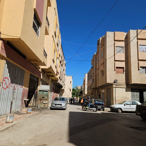 Person photographed on narrow street in Fez, Morocco
