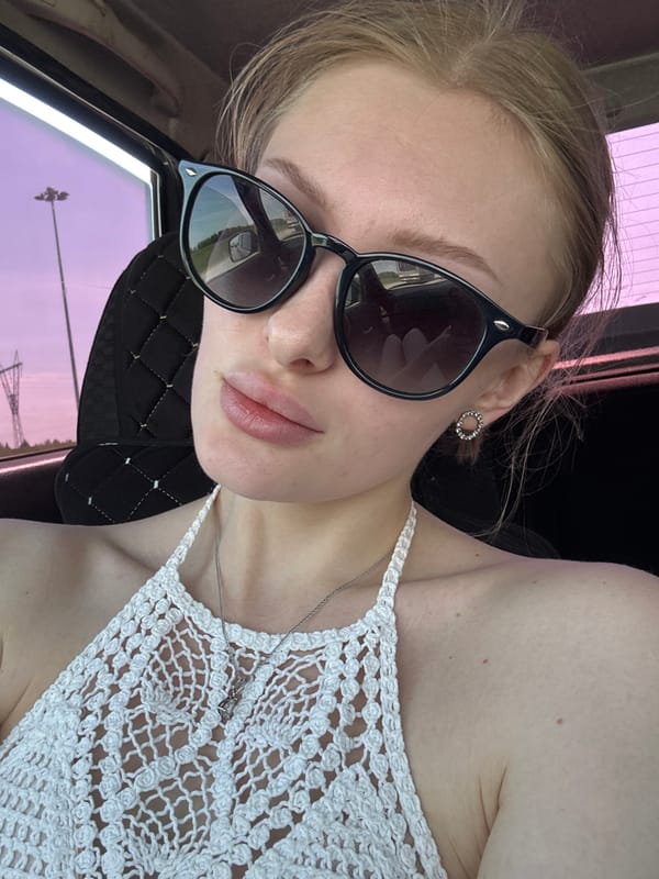 Woman takes selfie in vehicle in Perm, Russia