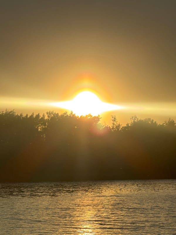 Sunset captured over lake in rural Belarus village