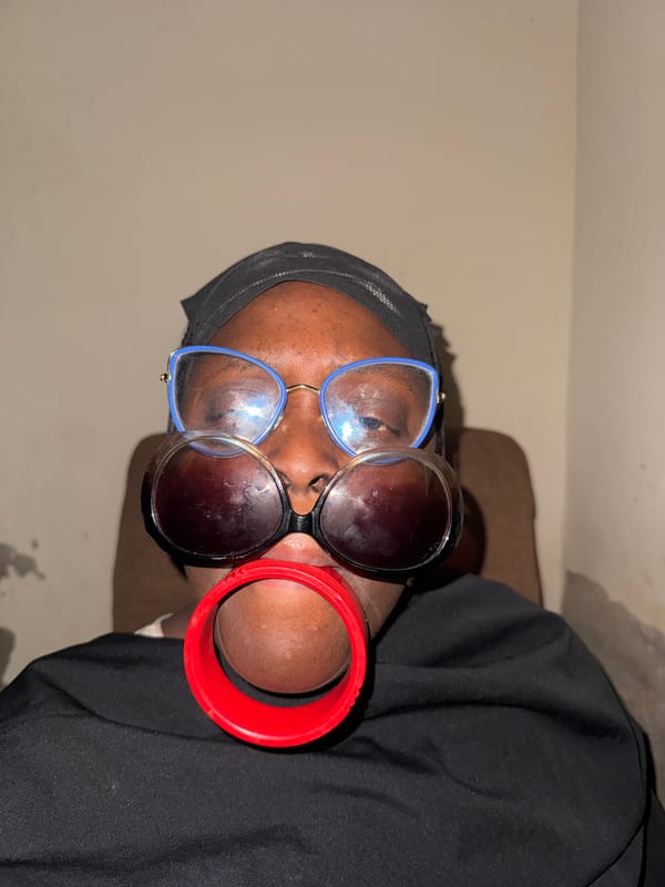 Person in Yelwa photographed wearing multiple pairs of glasses