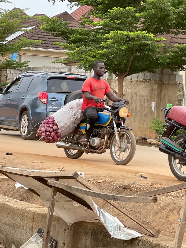 Morning street life documented across Abuja residential areas