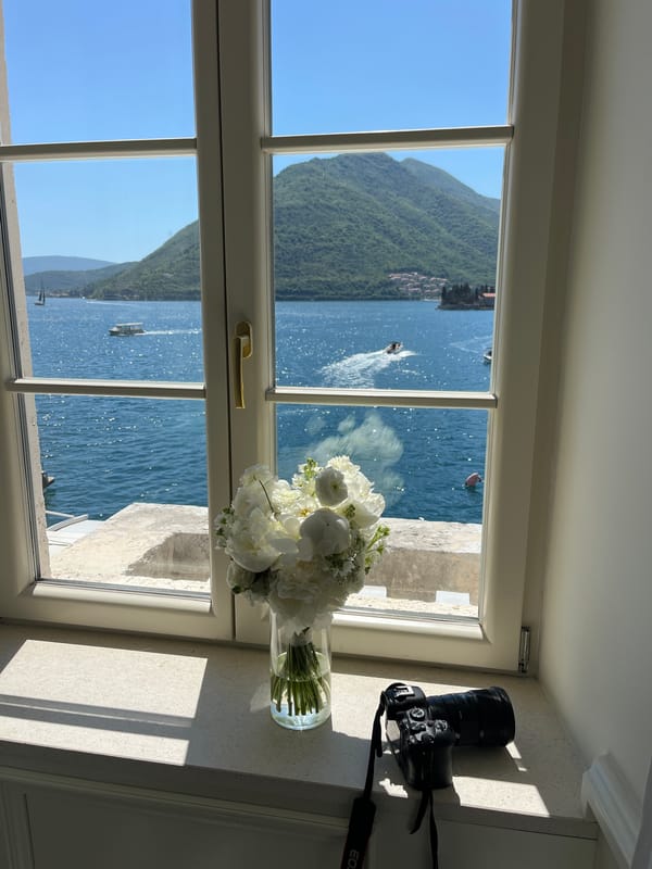 Bay of Kotor framed through a window in Perast