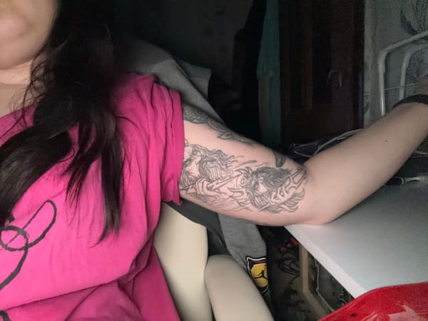 Person displays multiple tattoos including Arabic text in Bulgaria