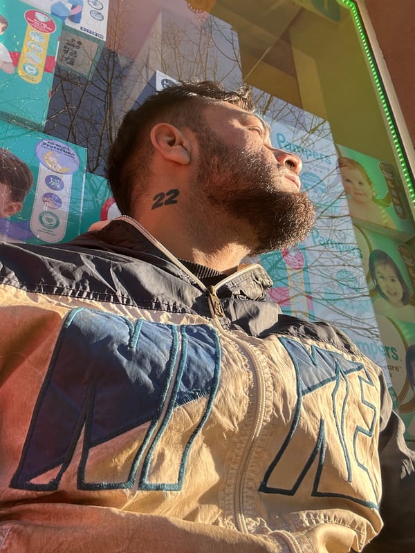 Man studies bus advertisement in early morning Tsarevo