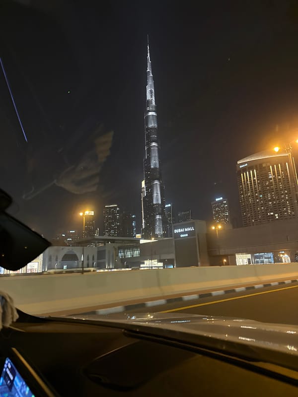 Witness captures Dubai skyline view featuring illuminated Burj Khalifa
