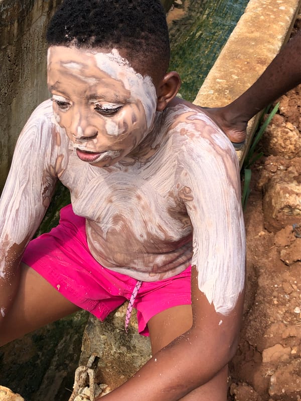 Mud-covered afternoon outdoors with dump trucks and casual play