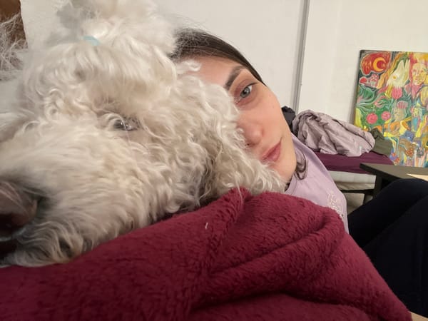 Woman takes selfie with white fluffy dog in Krasnoyarsk